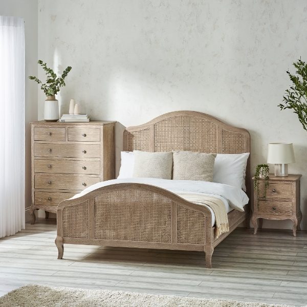 Bedroom with a wooden bed and matching nightstands.
