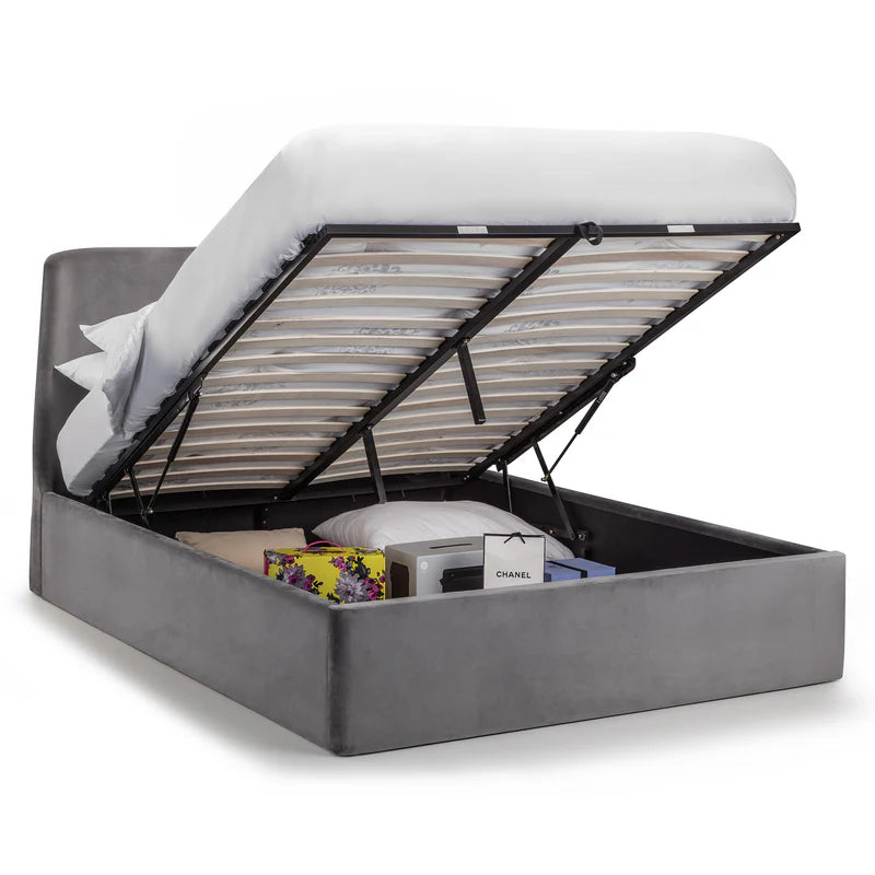 Gray upholstered bed with open storage compartment on a white background