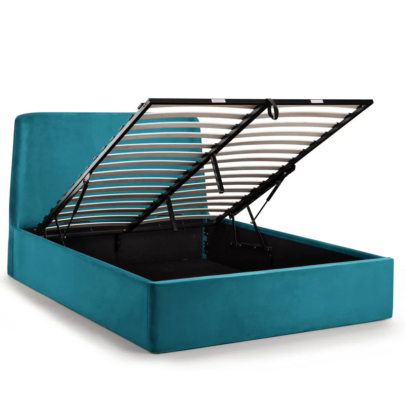 Teal bed with open storage compartment on a white background