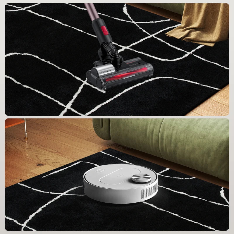 Vacuum cleaner and robot vacuum on a black and white patterned rug.