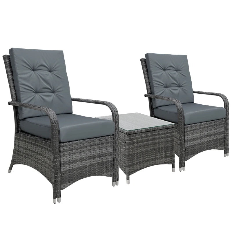 Two gray cushioned chairs with a small table on a white background