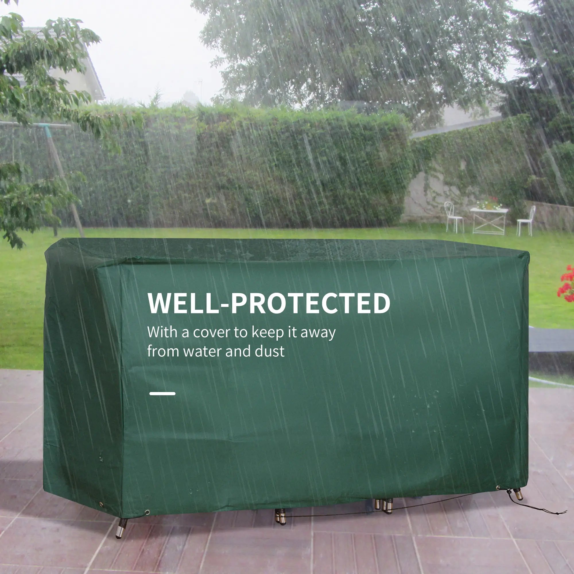Green outdoor furniture cover protecting a table from rain in a garden setting.