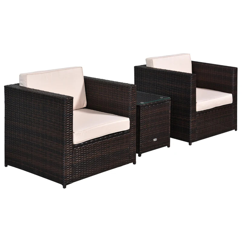 Two dark brown wicker chairs with white cushions on a white background