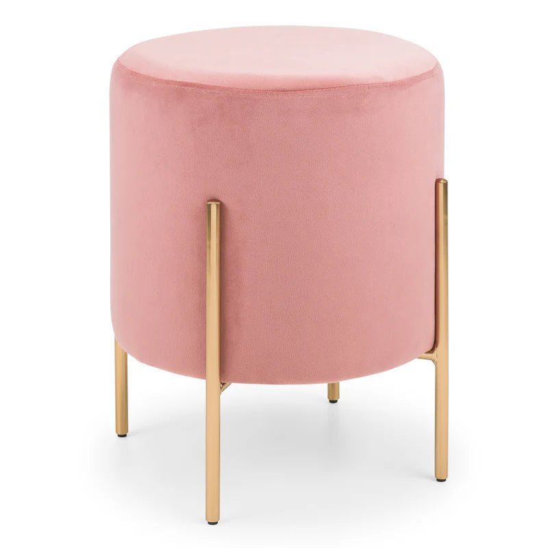 Pink ottoman with gold legs on a white background