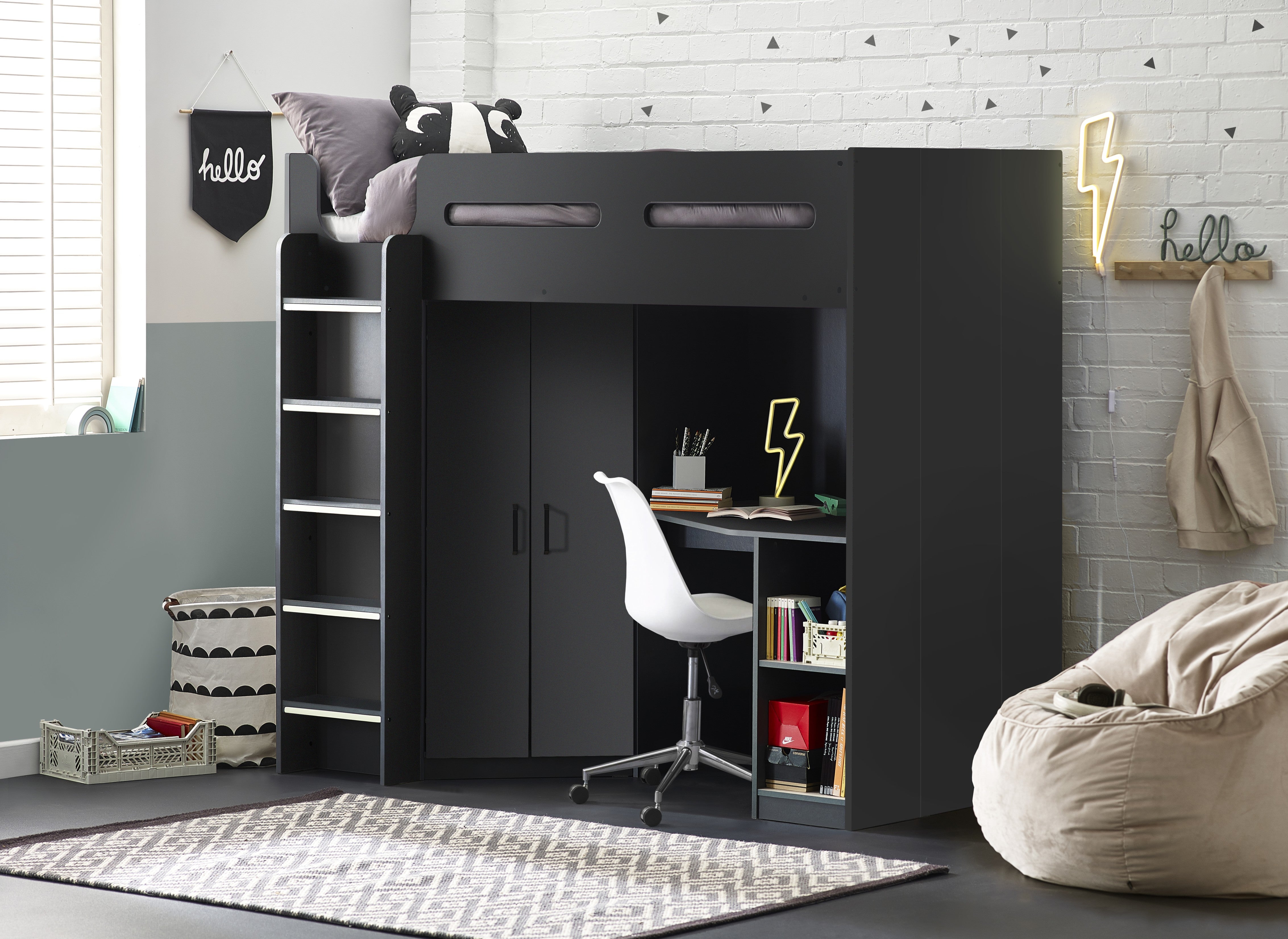 Black loft bed with desk and shelves in a room with a bean bag chair and decor.