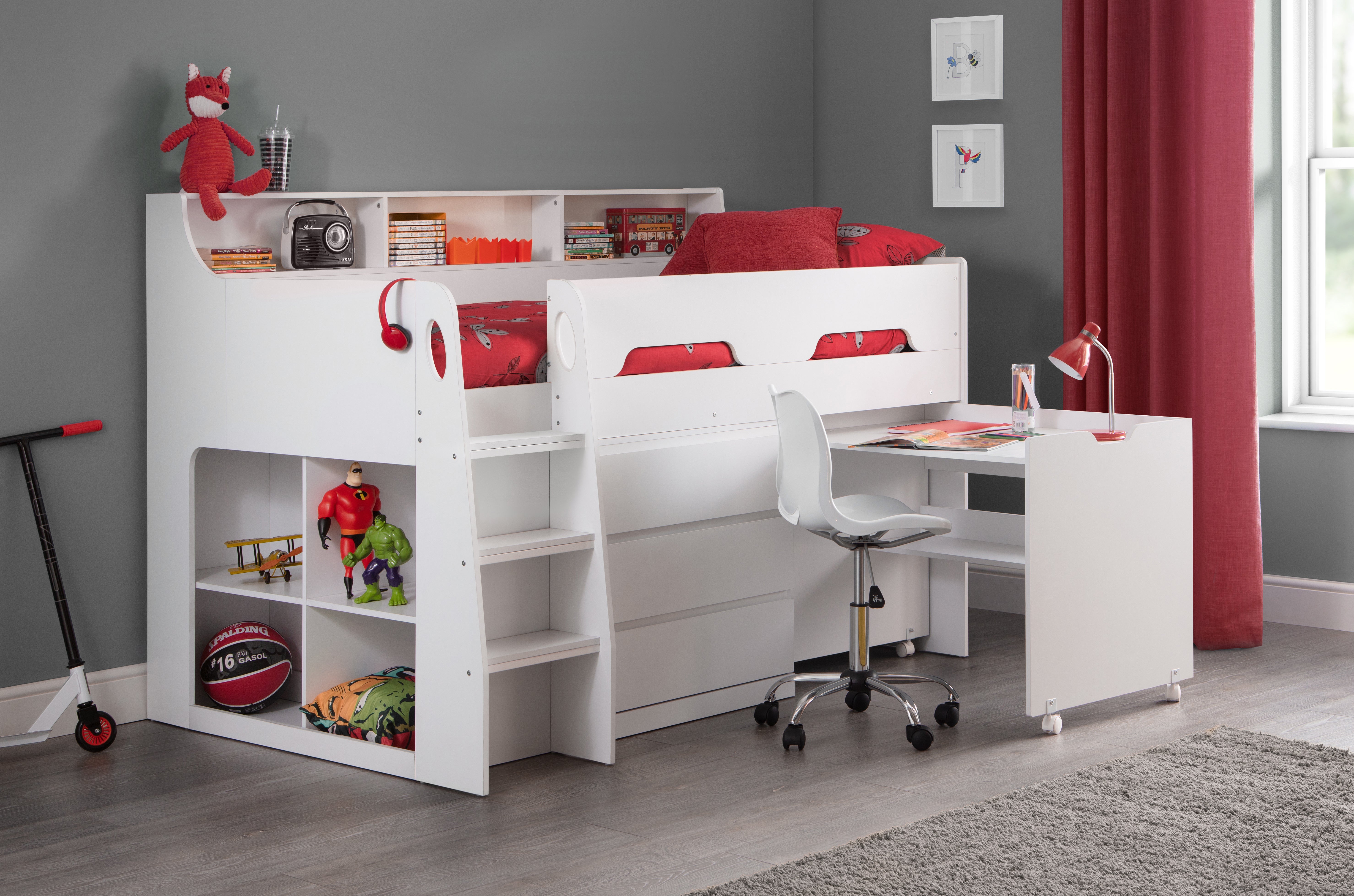 White loft bed with desk and shelves in a room with red curtains and toys.