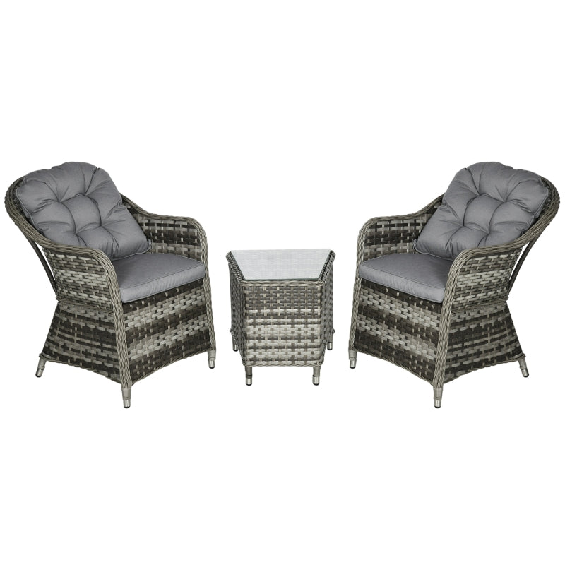 Two wicker chairs with gray cushions and a matching table on a white background
