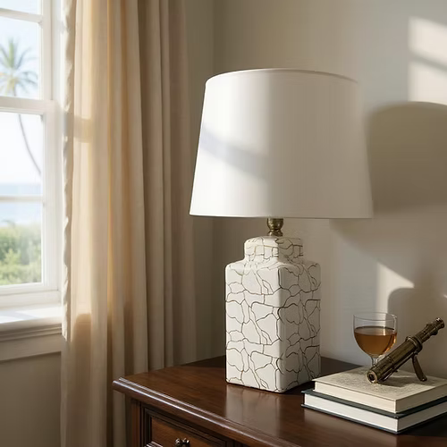 Decorative lamp with cracked pattern on a wooden table near a window