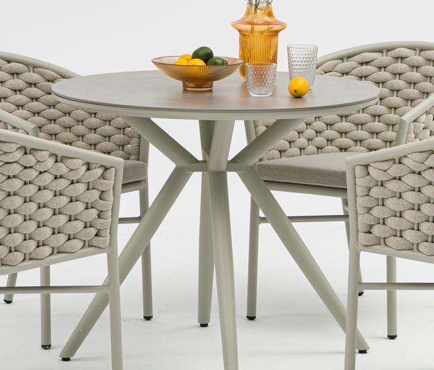Round table with chairs on a white background