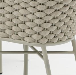 Close-up of a woven chair seat with a neutral color palette.