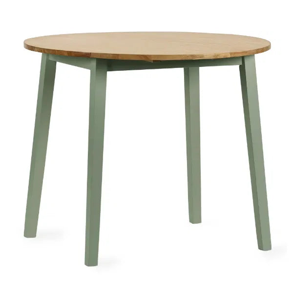 Round wooden table with green legs on a white background