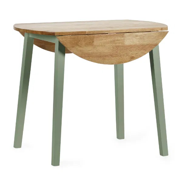 Wooden dining table with green legs on a white background