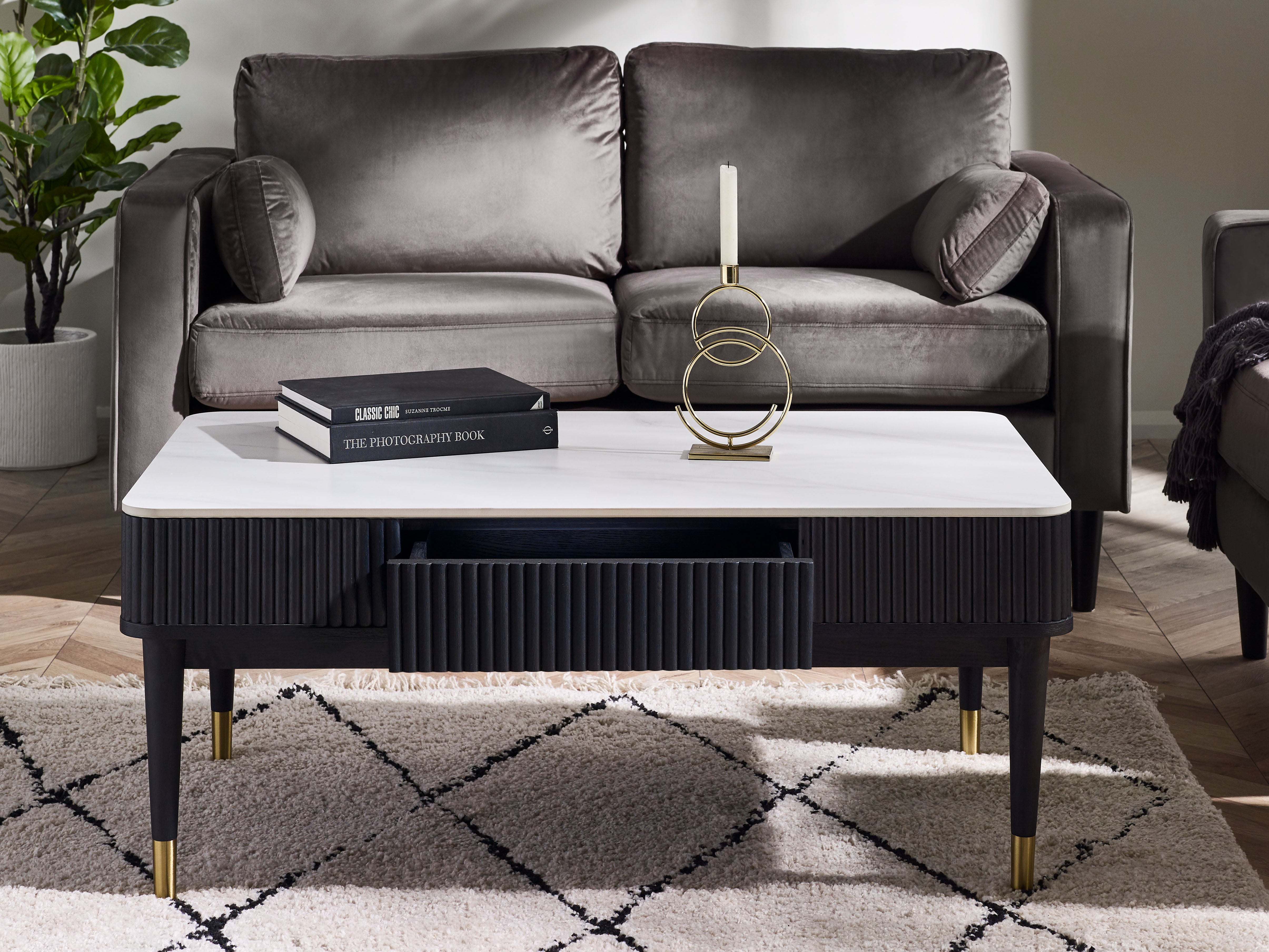 Gray sofa with a coffee table in a living room setting