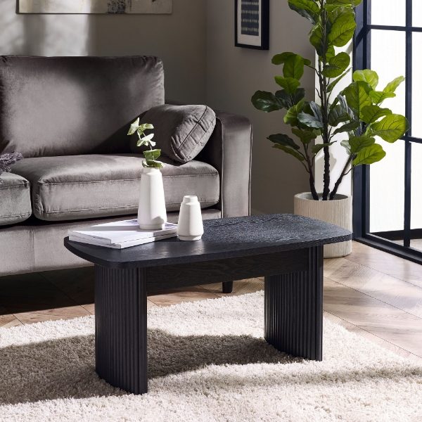 Black coffee table in a lounge setting. 