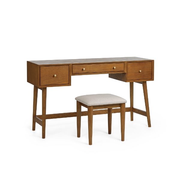 Wooden desk with three drawers and a matching stool on a white background