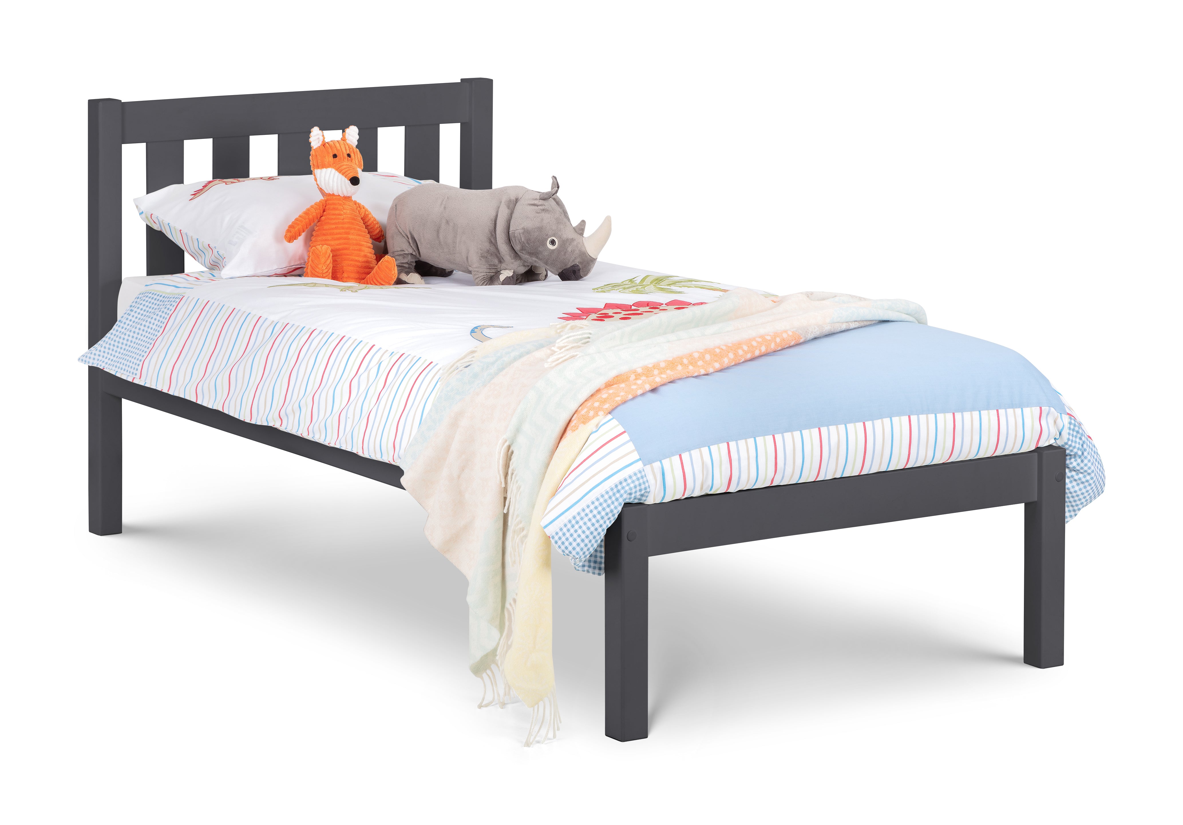 Children's bed with colorful bedding and stuffed animals on a white background