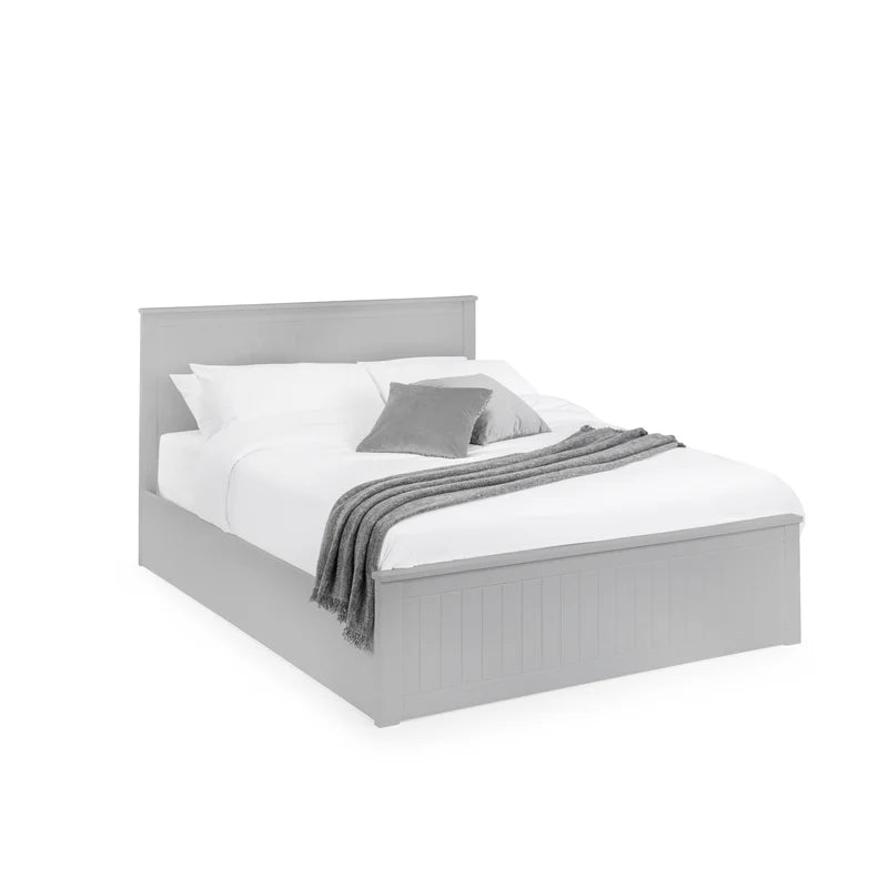 Gray bed frame with white bedding and gray blanket on a white background