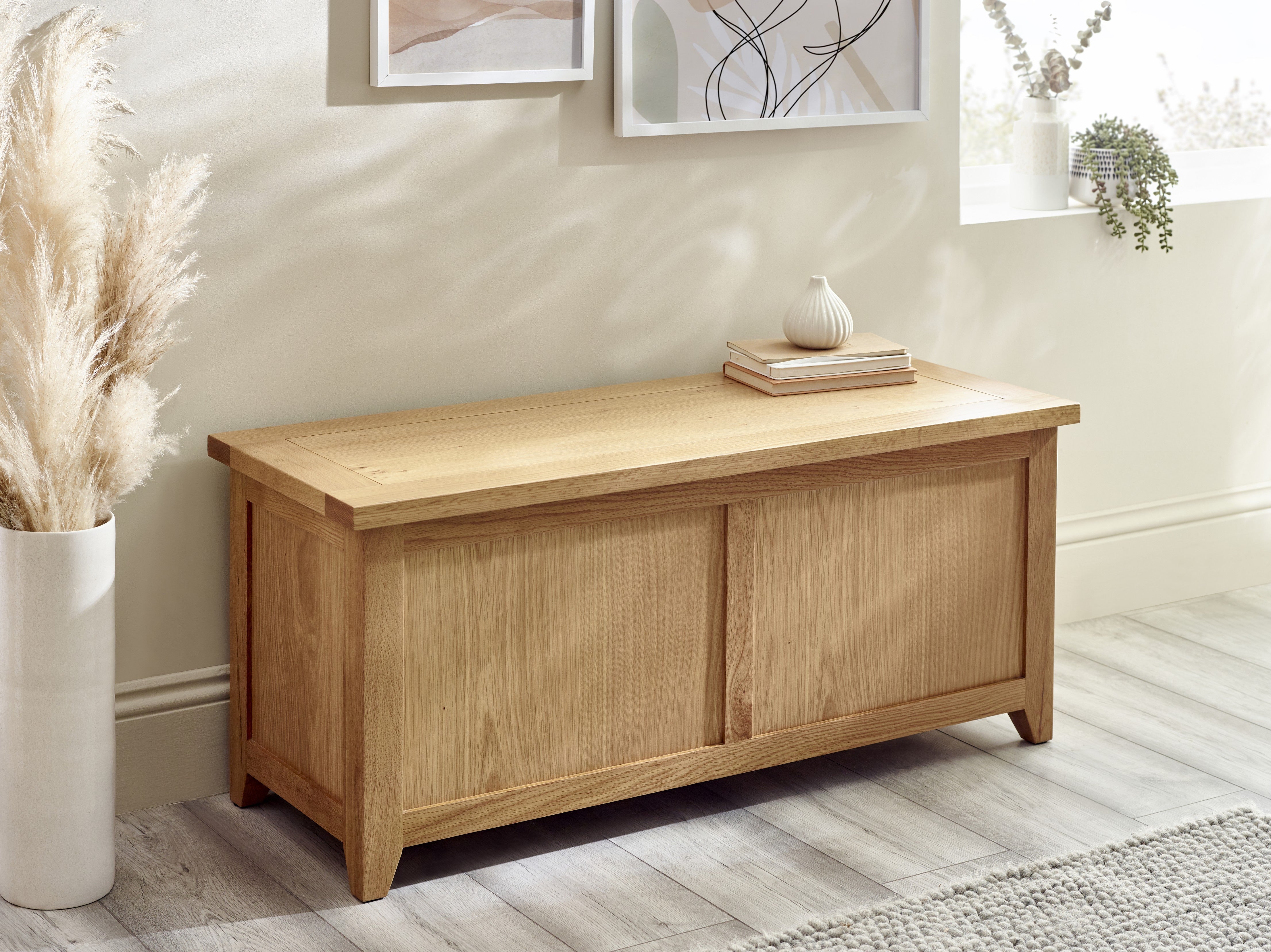 Wooden storage bench in a room with decor elements