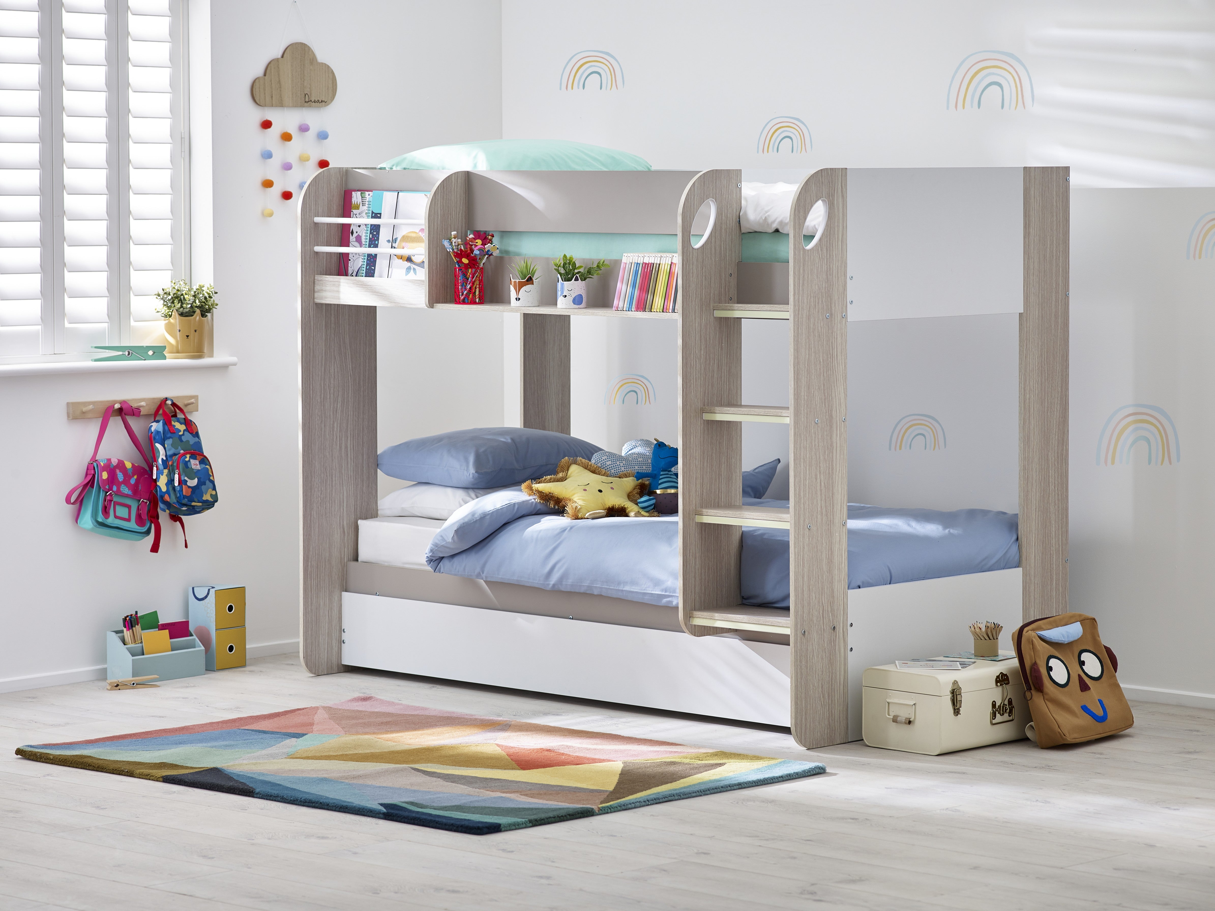 Children's bedroom with a bunk bed, toys, and decorative elements.