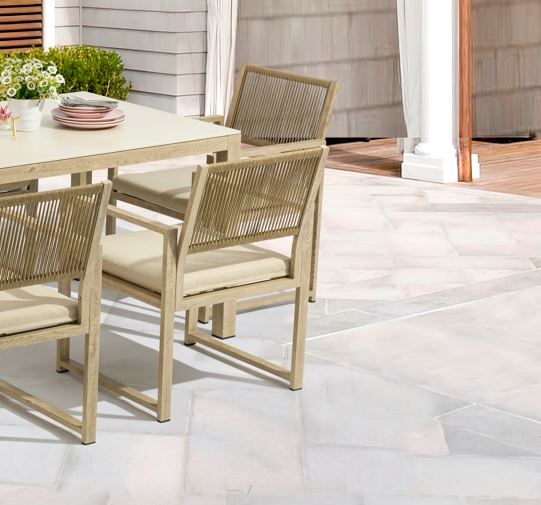 Outdoor dining set with table and chairs on a patio