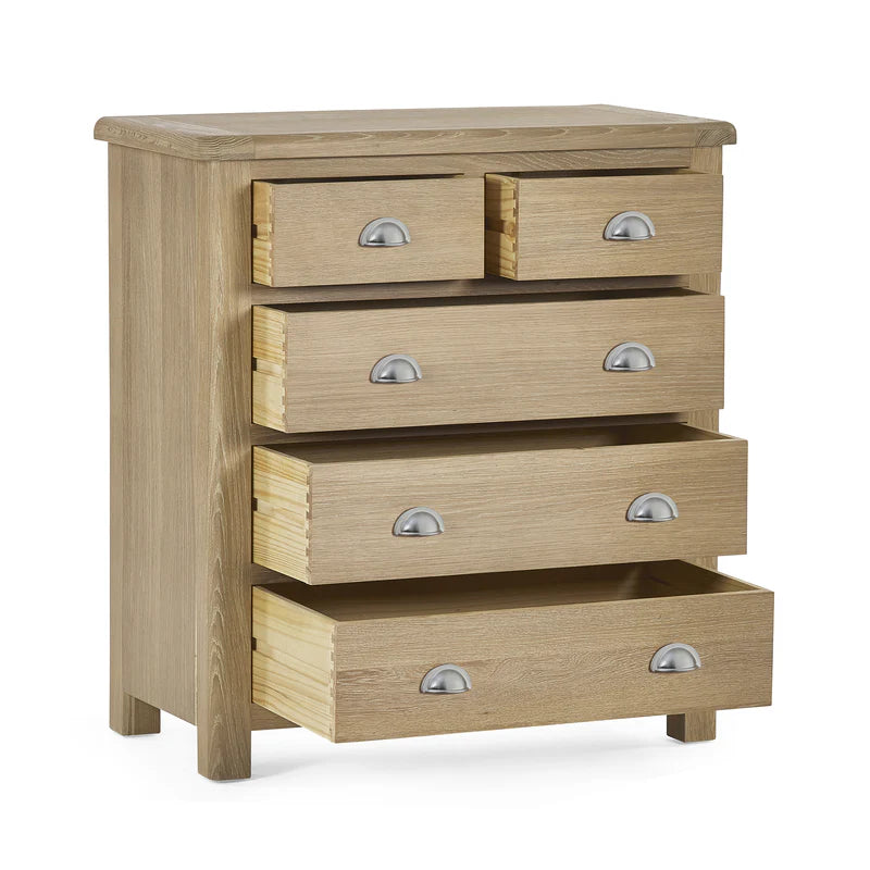 Wooden dresser with four drawers on a white background
