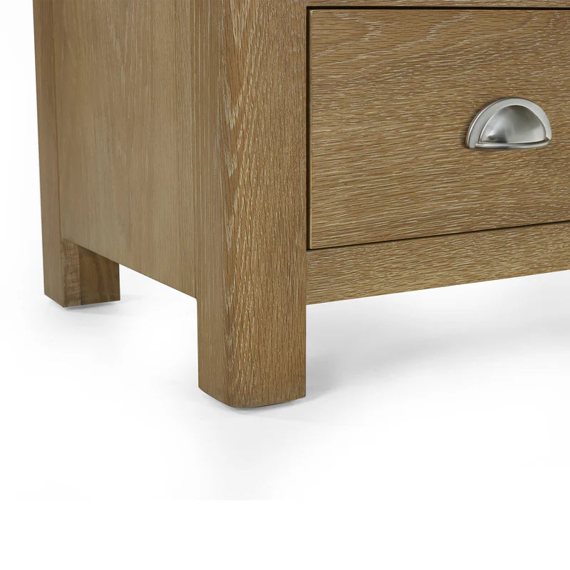 Wooden drawer with metal handle on a white background
