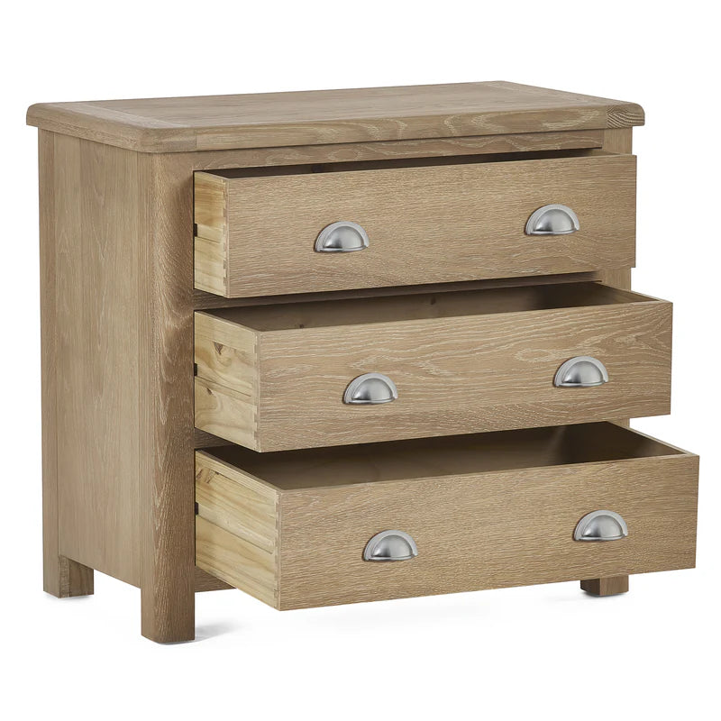 Wooden chest of drawers with three drawers on a white background