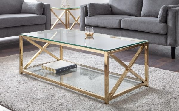 Gold coffee table with glass top in a living room setting