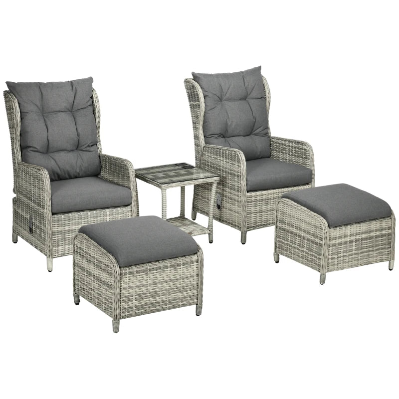 Outdoor furniture set with wicker chairs, ottomans, and a table on a white background