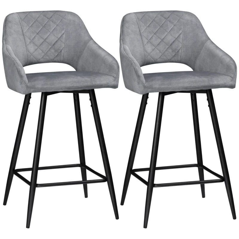 Two gray bar stools with quilted design and black legs on a white background