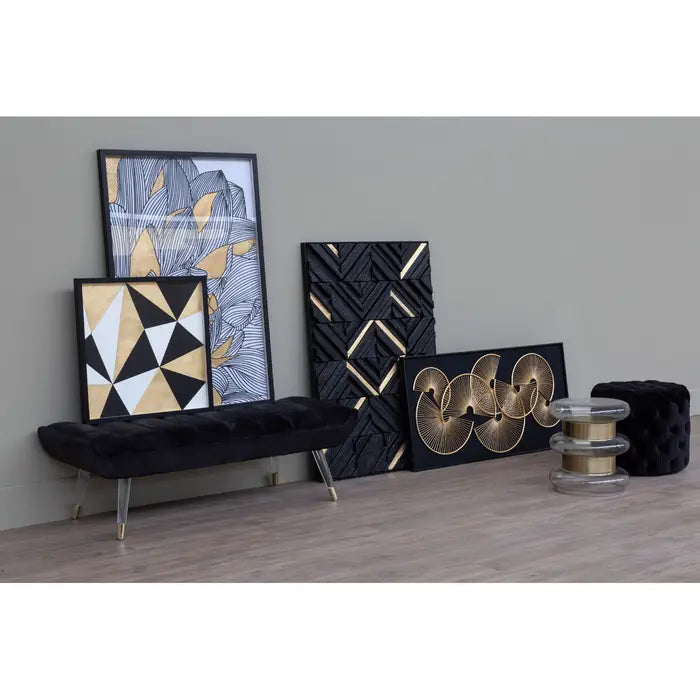 Decorative wall art pieces with geometric patterns on a gray wall.