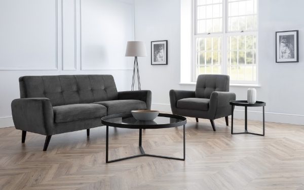 Gray sofa and armchair set in a living room with a coffee table.