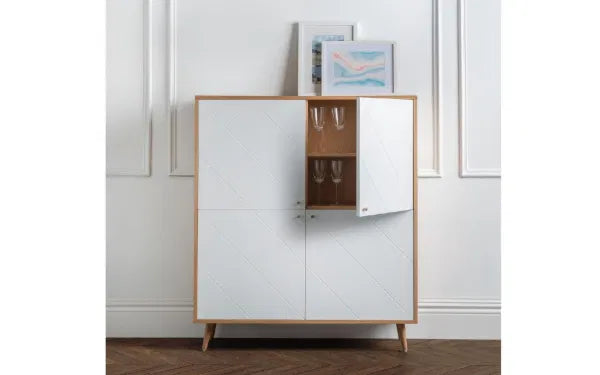 White cabinet with wooden accents against a white wall