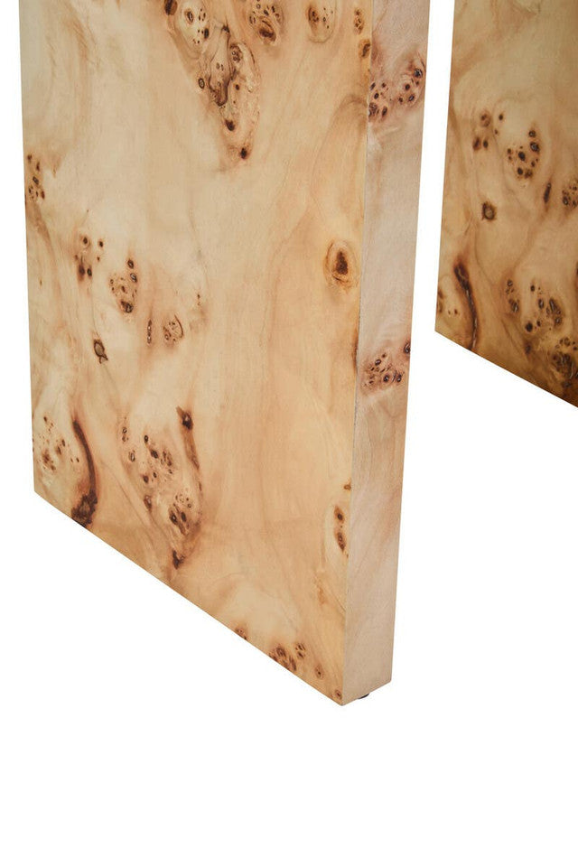 Close-up of a wooden surface with a burl pattern on a white background