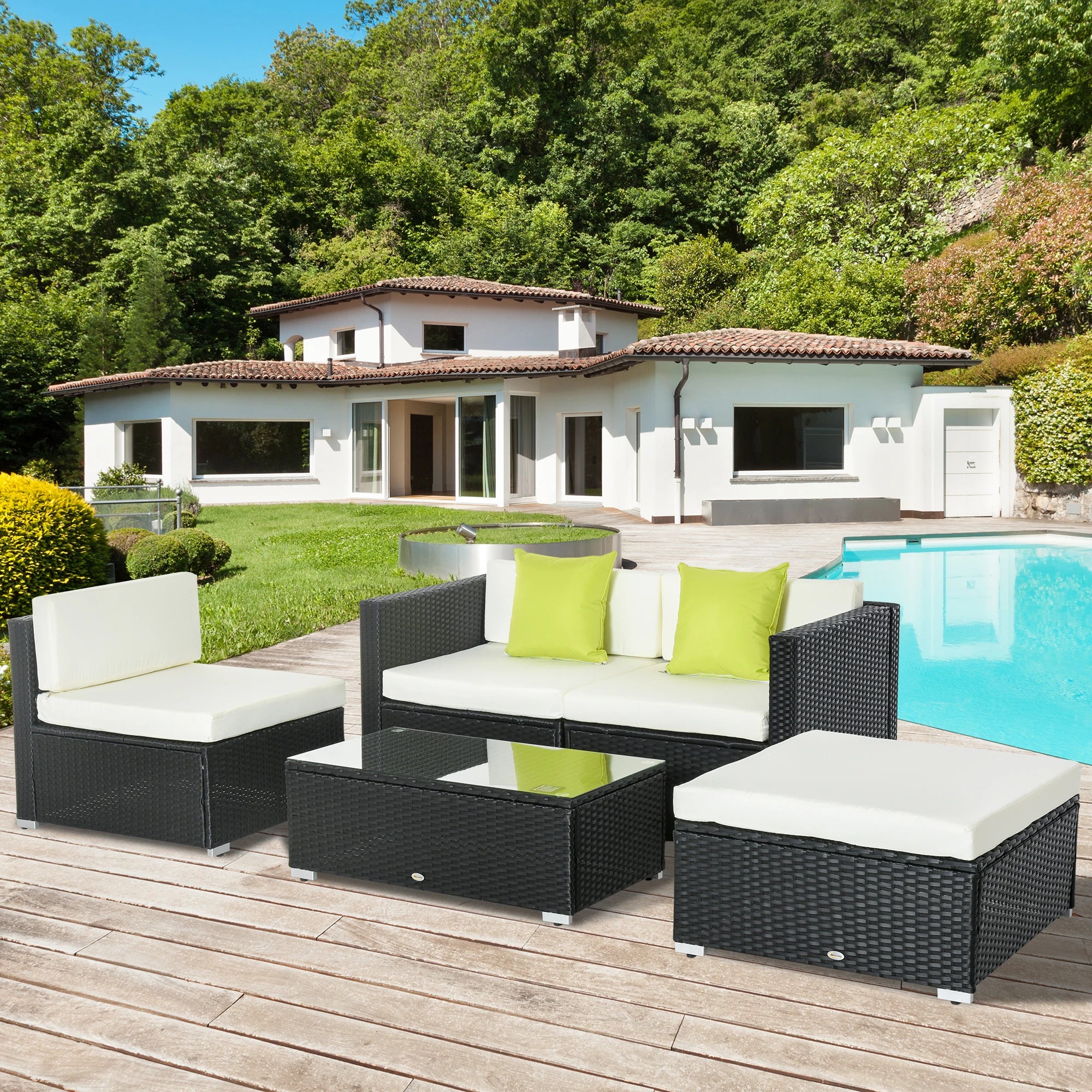 Compact rattan garden sofa set styled on a bright patio surrounded by greenery