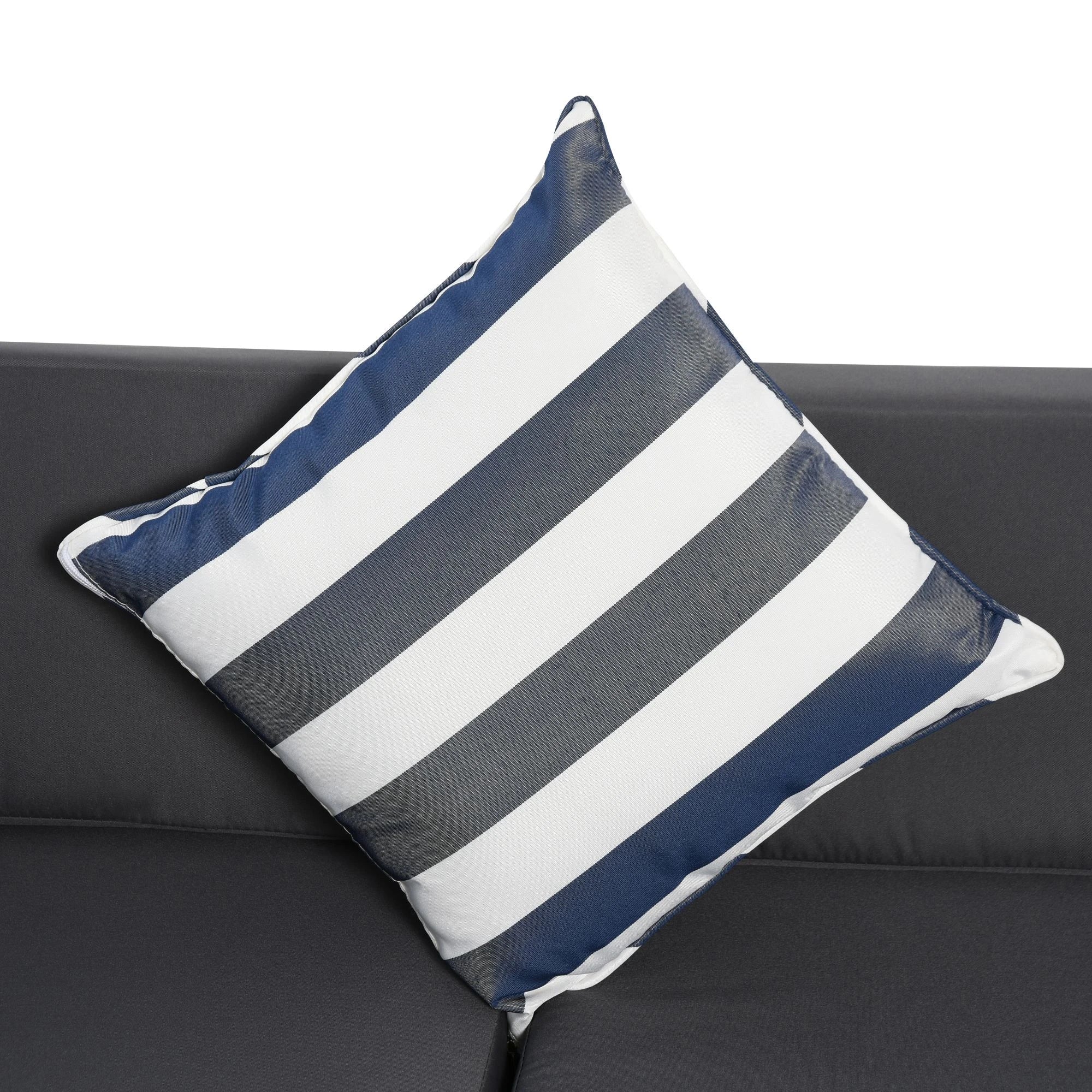 Striped blue and white pillow on a black couch