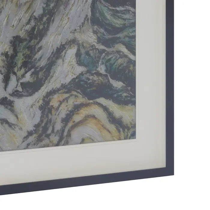 Close-up of a framed abstract painting with a dark blue border.