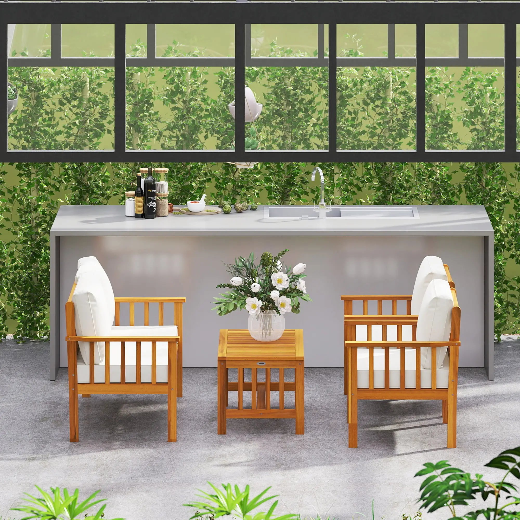 Outdoor patio set with chairs, table, and flowers against a green wall.