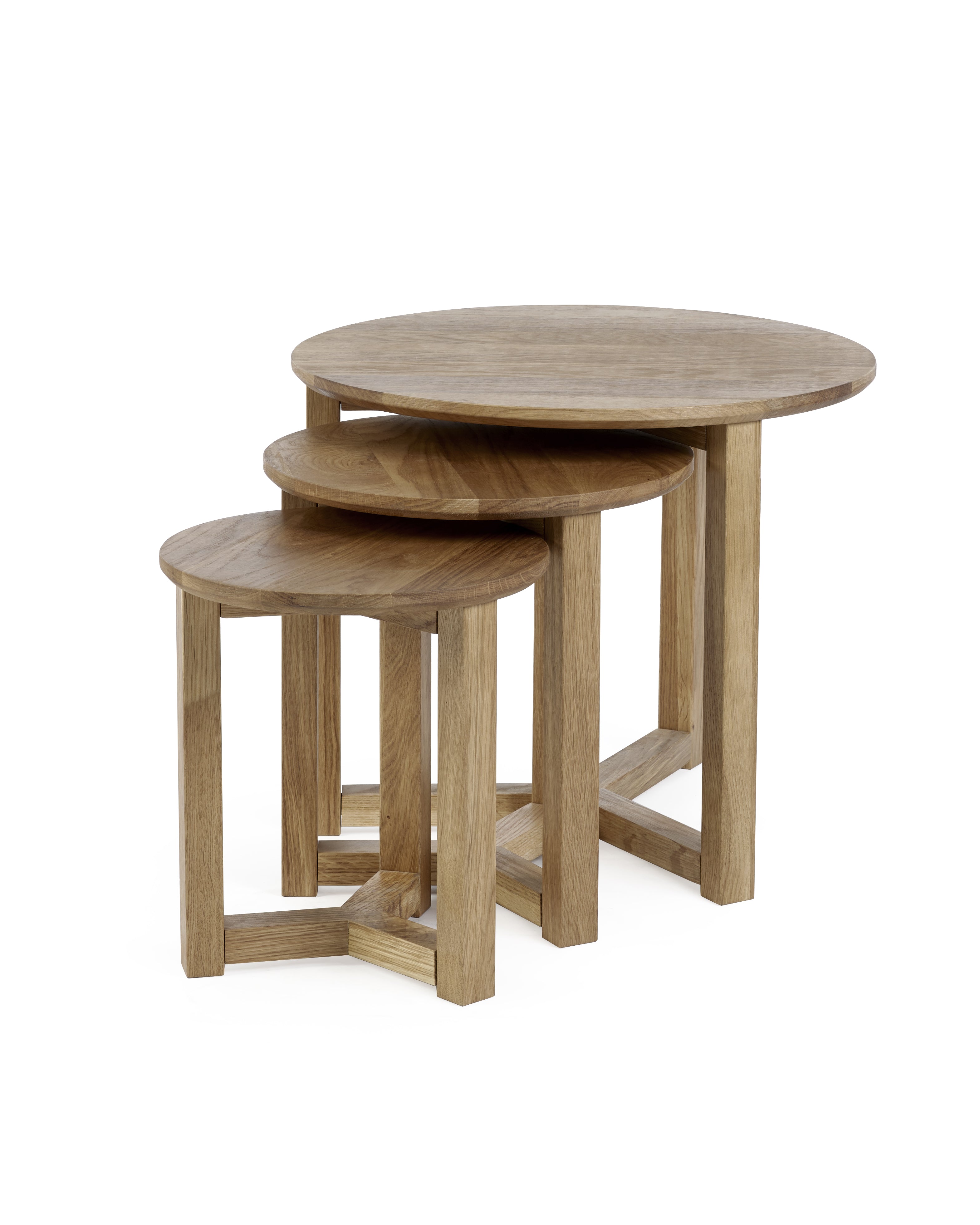 Set of three wooden nesting tables on a white background