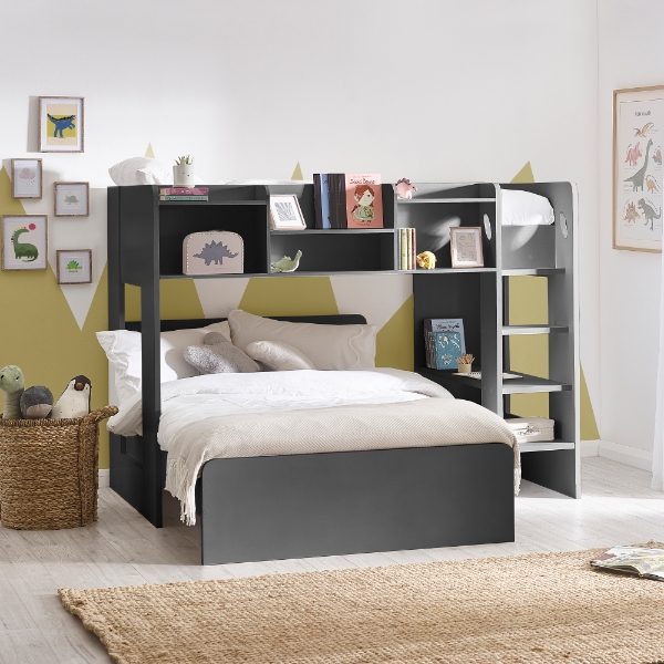 Bunk bed with bookshelves in a room with colorful walls and decor.