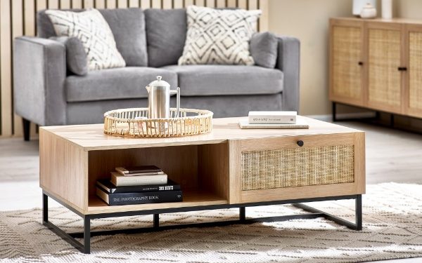 Wooden coffee table with decorative items in a living room setting