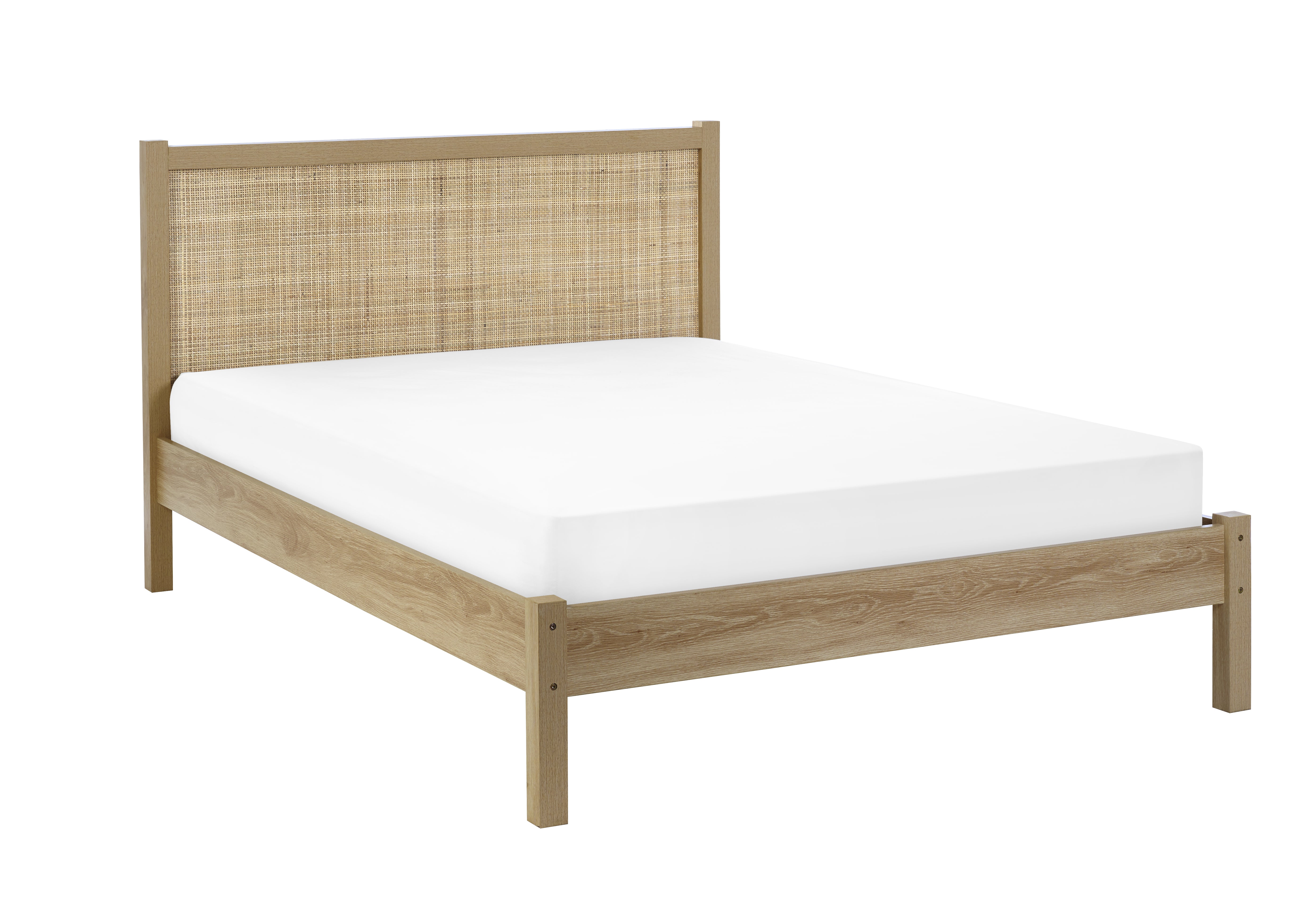 Bed with wicker headboard and white mattress on a white background