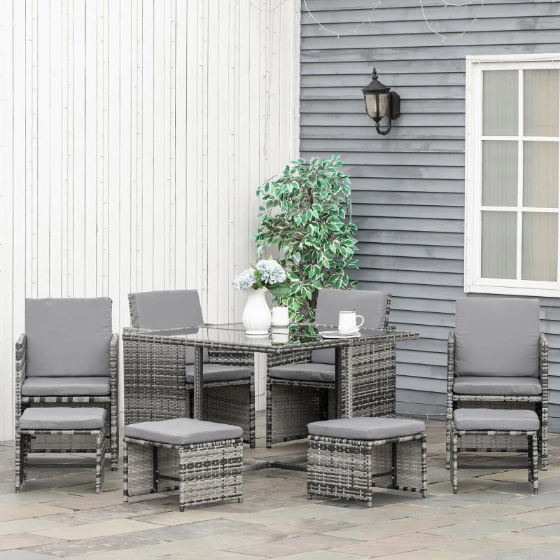 Outdoor patio set with table and chairs on a patio deck.