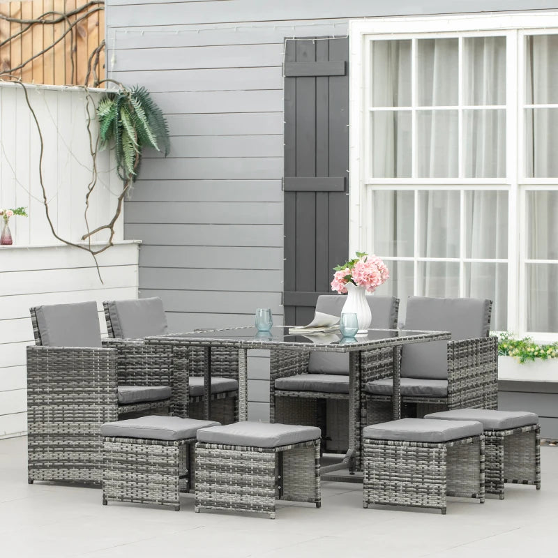 Outdoor patio set with table and chairs on a patio deck.