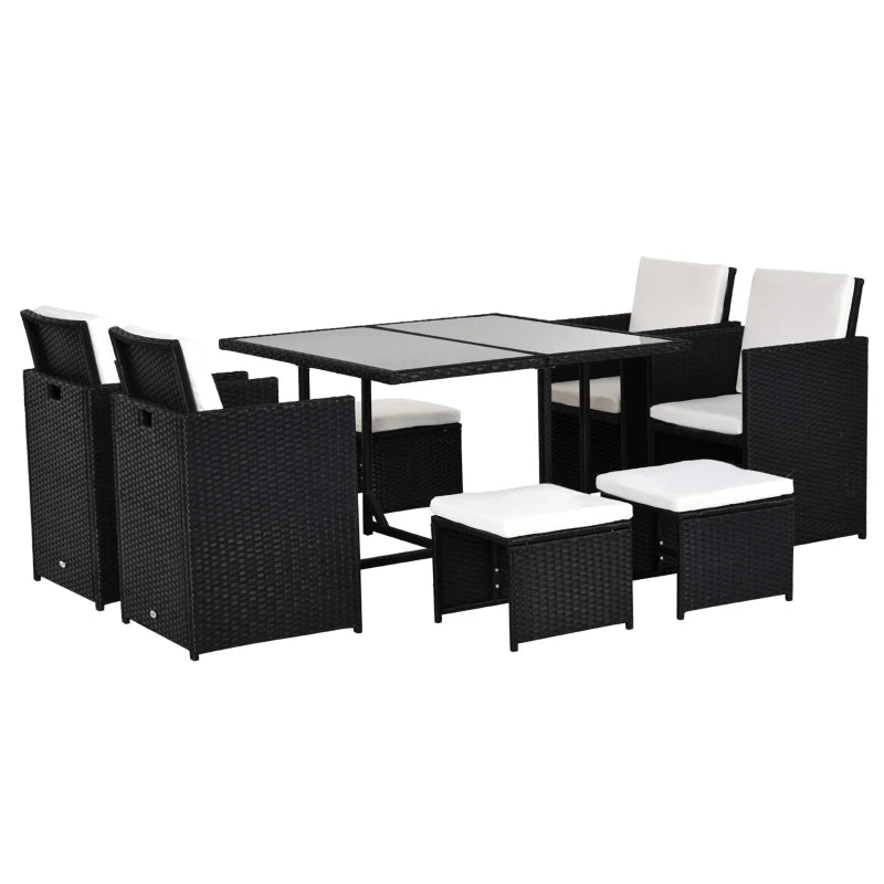 Outdoor furniture set with black wicker chairs and table on a white background