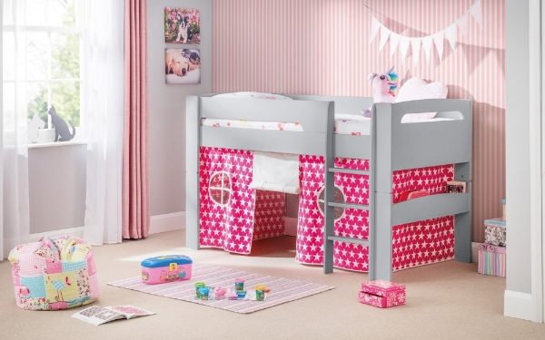 Children's room with a gray and pink bed, toys, and decorative items.