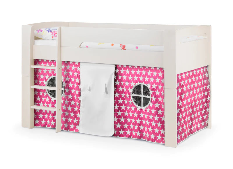 Children's bed with pink star-patterned curtains on a white background