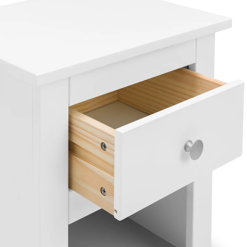 White dresser with a wooden drawer open on a white background