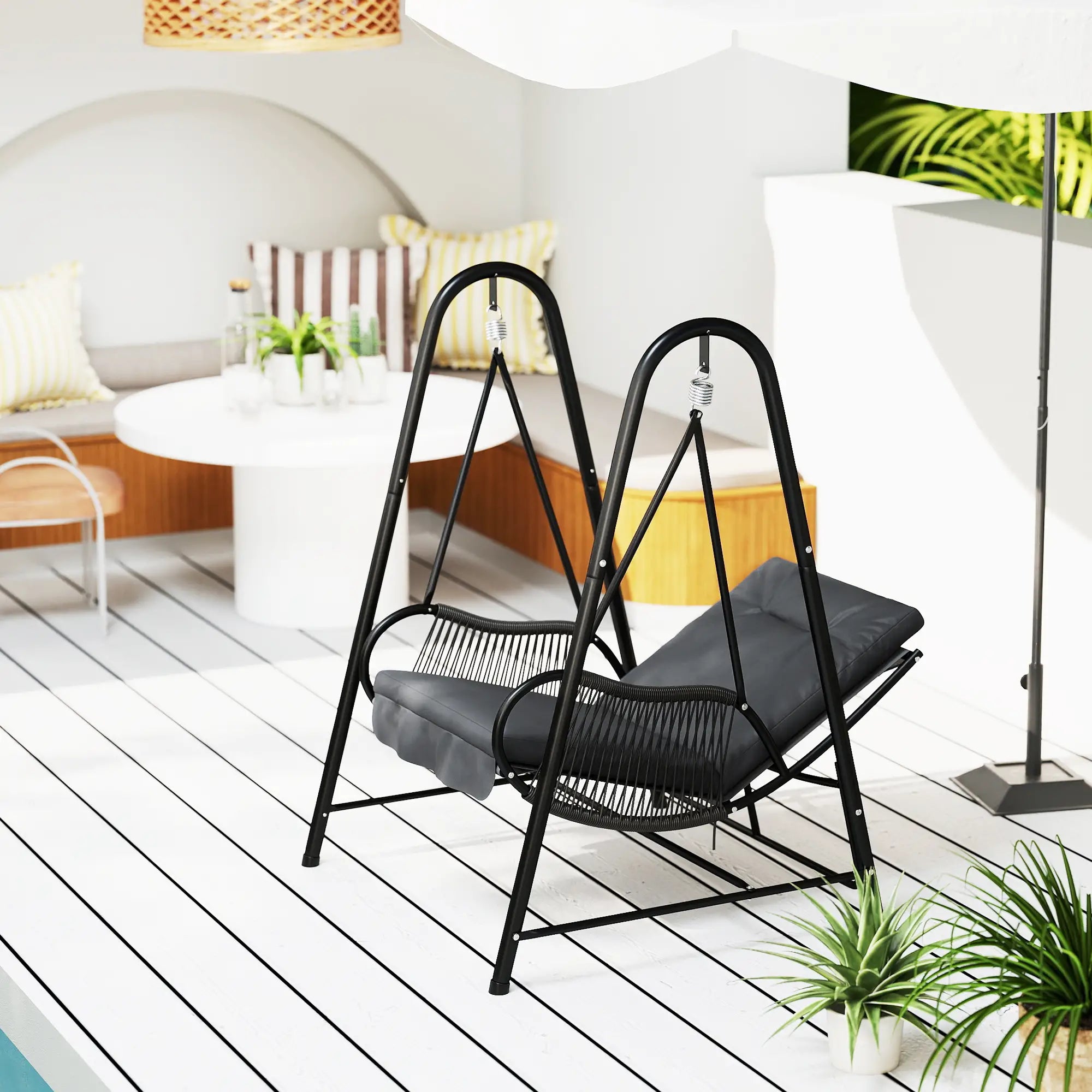 Black metal swing chair on a white deck with a modern interior background