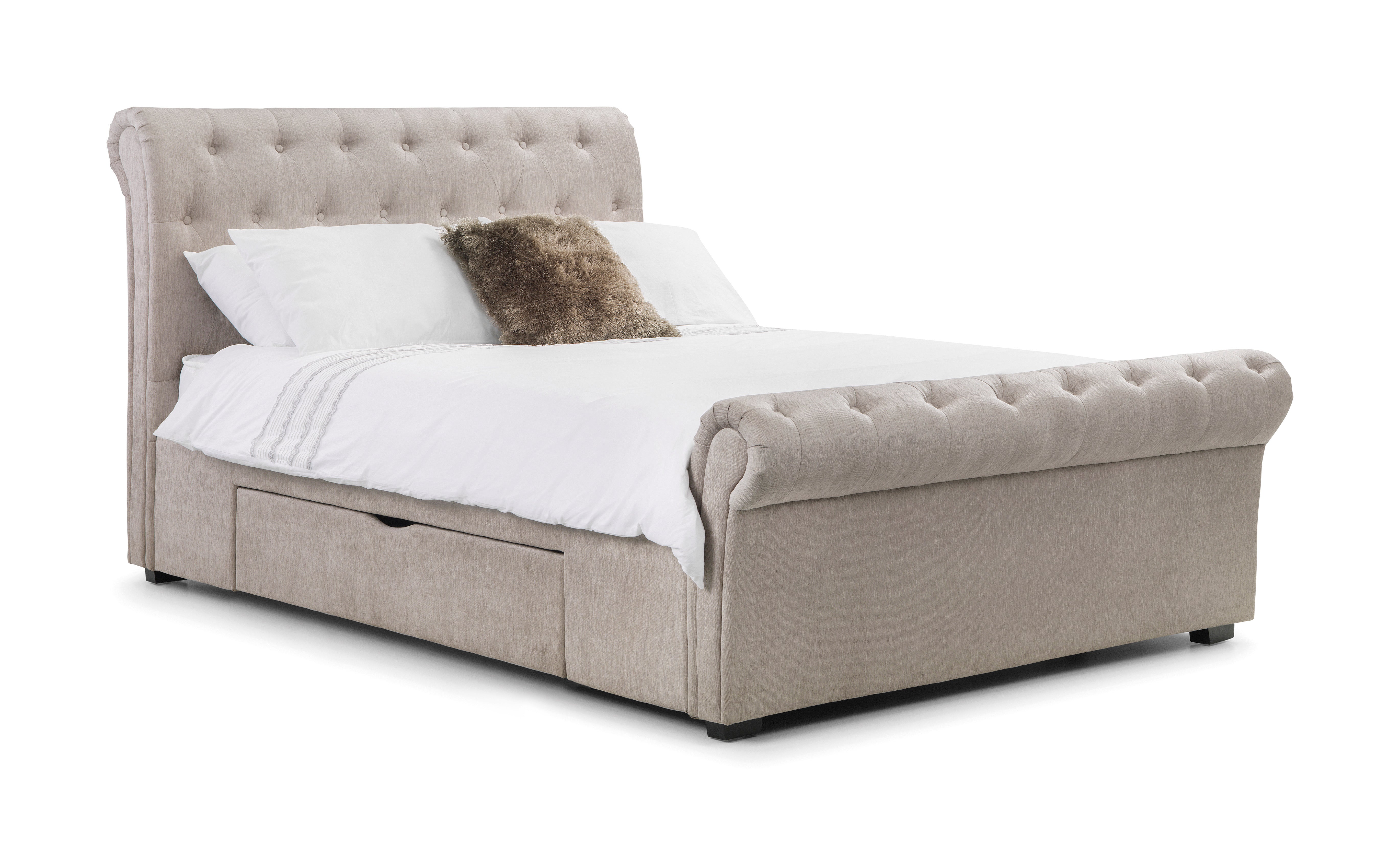 Beige upholstered bed with white bedding and a brown pillow on a white background